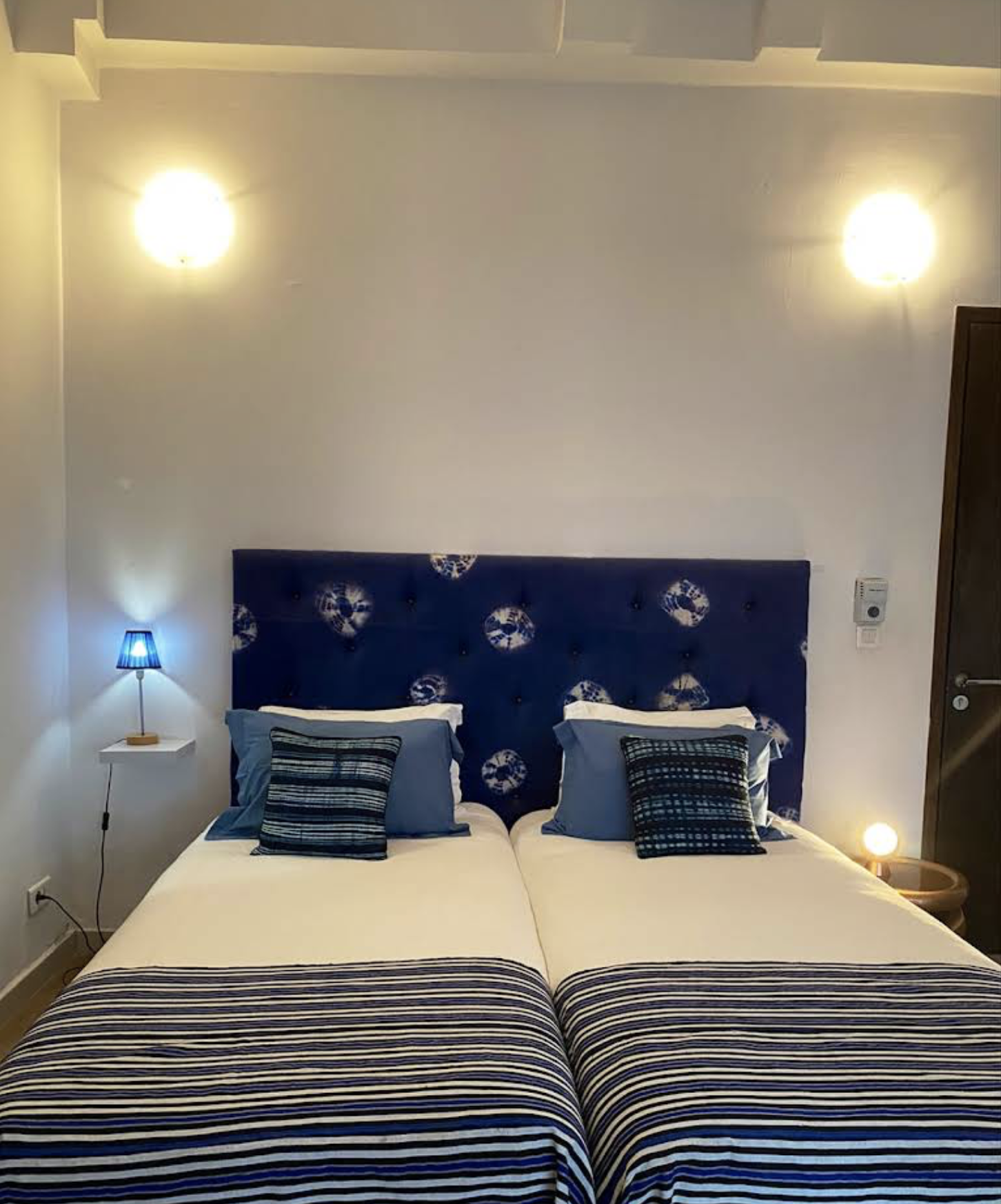 Indigo room — two single beds with blue striped bedding