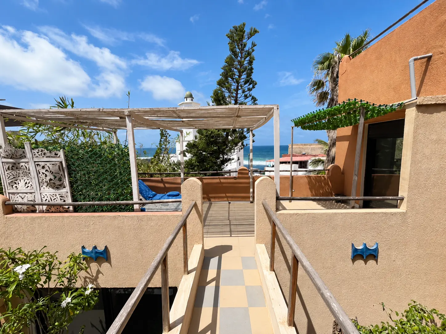 Deluxe Private Apartment — terracotta terrace and walkway overlooking the sea