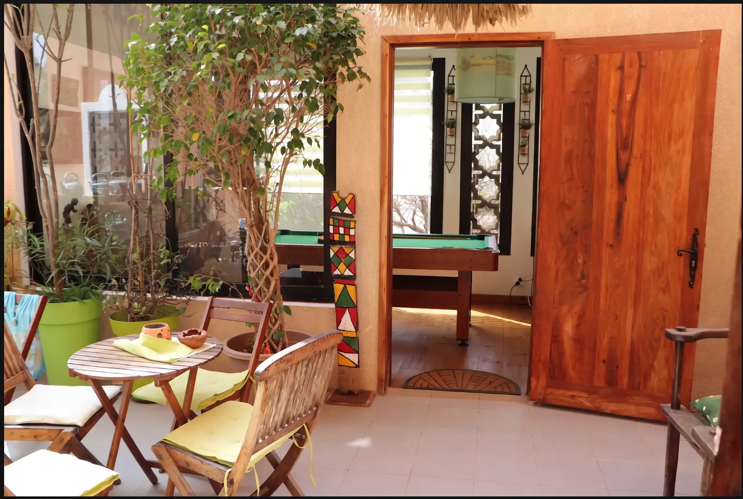Shaded patio seating outside the games room